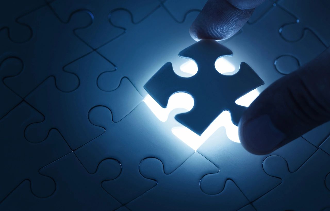 Business Concept, Male Hand Putting Missing Piece of Jigsaw Puzzle